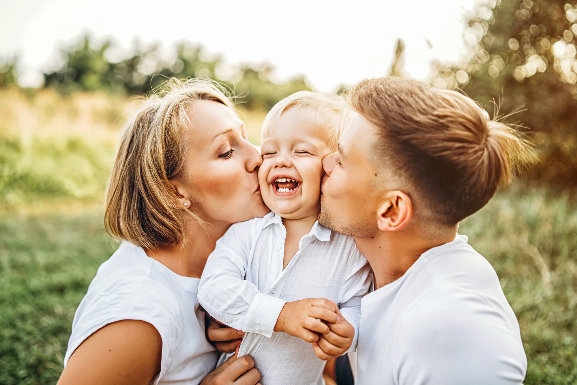 Smiling family embracing outdoors